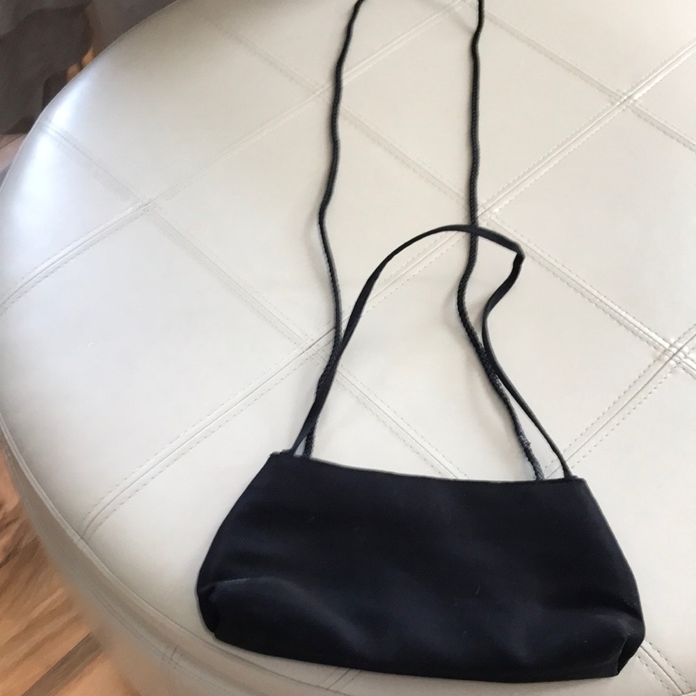 Small black silk bag.